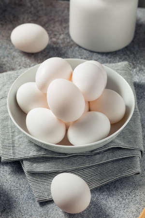 Raw Organic Cage Free White Eggs in a Groupの写真素材