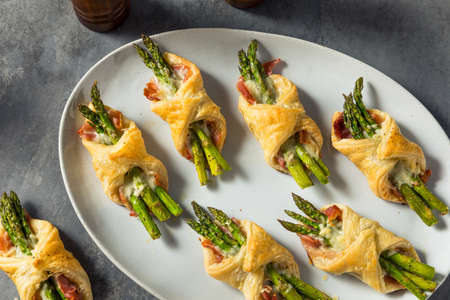 Homemade Asparagus Puff Pastry Appetizer with Prosciutto and Cheeseの写真素材