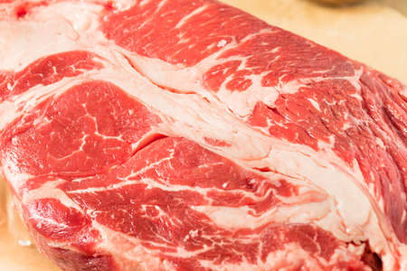 Raw Organic Grass Fed Chuck Roast with Salt and Pepperの写真素材