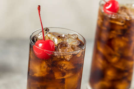 Cold Refreshing Cherry Cola Soda with a Strawの写真素材