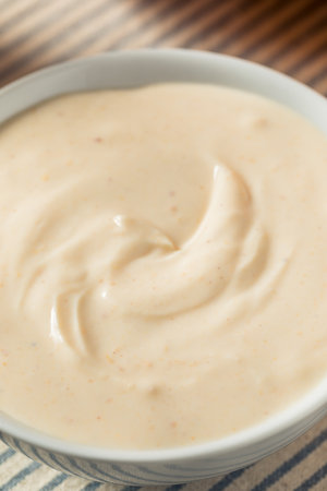 Homemade Pumpkin Spice Yogurt with a Spoon for Breakfastの写真素材