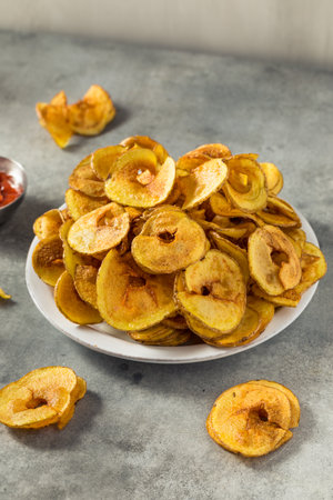 Homemade Spiral Cut Potato Chips with Salt and Ketchupの写真素材
