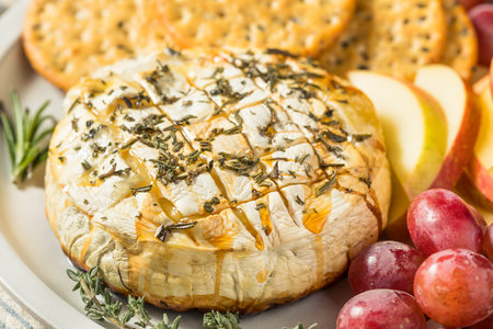 Homemade Baked Brie Appetizer with Apples and Crackersの写真素材
