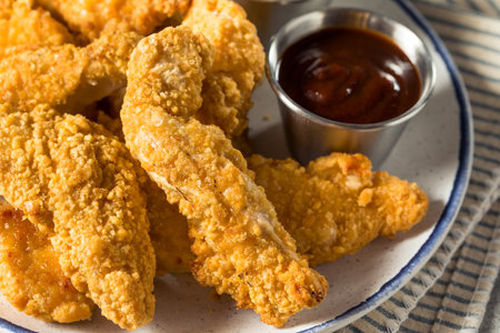 Homemade Deep Fried Chicken Strips with Mustard and BBQの写真素材