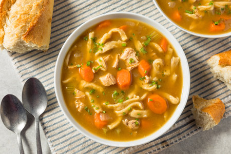 Homemade Chicken Noodle Soup with Carrots and Celeryの写真素材
