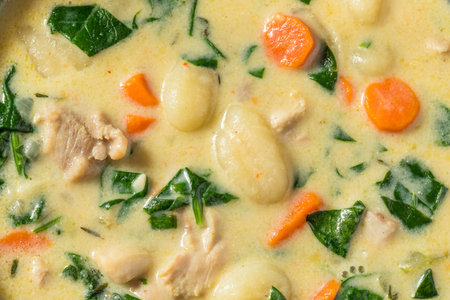 Homemade Creamy Chicken Gnocchi Soup with Carrots and Spinachの写真素材