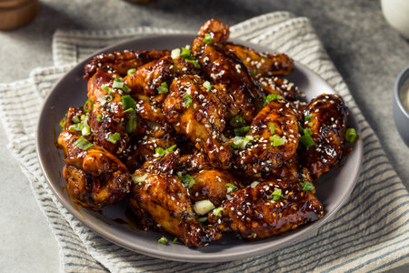 Homemade Asian Chili Crunch Chicken Wings with Sesame Seedsの写真素材
