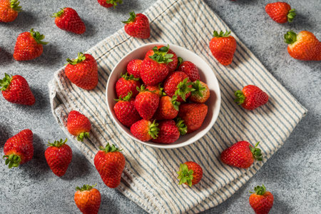 Raw Red Organic Sweet Strawberries in a Bowl Ready to Eatの写真素材