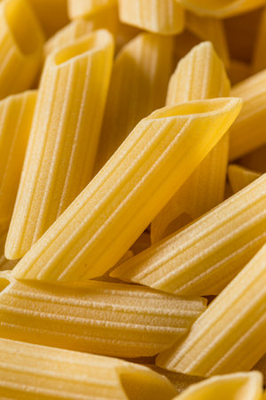 Raw Organic Pennoni Pasta in a Bowl
