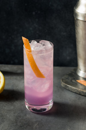 Boozy Refreshing Purple Empress Highball Cocktail with Grapefruit and Ginの写真素材