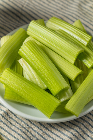 Raw Green Organic Celery Sticks to Eat for a Snackの写真素材