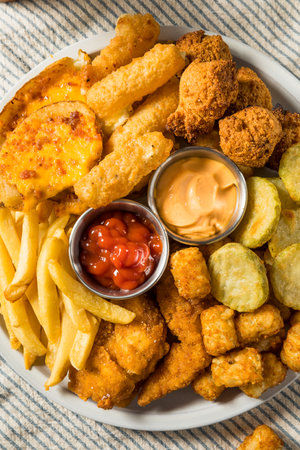 Deep Fried Appetizer Platter with French Fries Tots Mozzarella Sticks and Chickenの写真素材