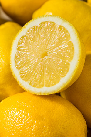 Organic Raw Seedless Yellow Lemons in a Bunchの写真素材