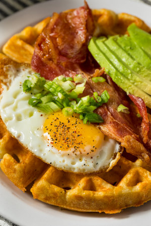 Homemade Savory Waffles with Bacon Egg and Avocadosの写真素材