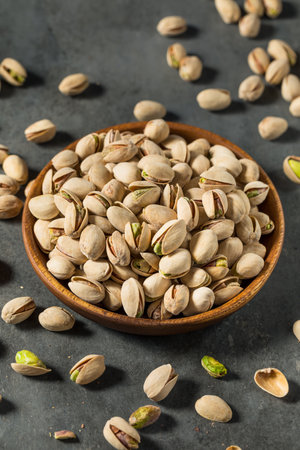 Salted and Roasted Pistachios in a Bowlの写真素材