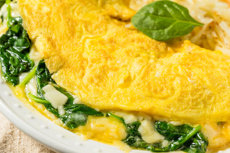 Homemade Spinach Florentine Omelet with Cheese and Potatoes