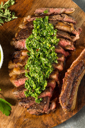 Homemade Chimichurri Sauce and Ribeye Steak with Garlicの写真素材