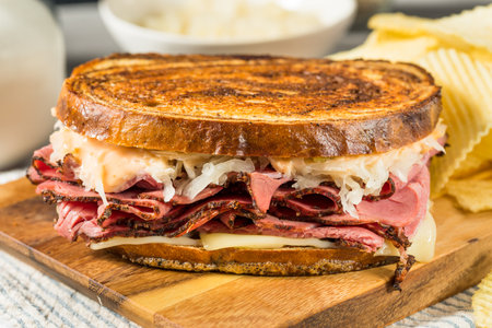 Homemade Russian Reuben Sandwich with Cheese and Chipsの写真素材
