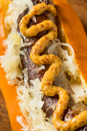 Homemade German Bratwurst Sausage with Mustard and Sauerkrautの写真素材