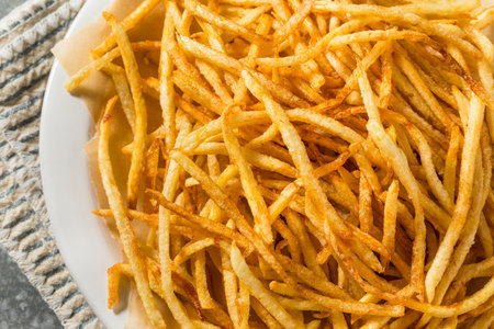 Homemade Shoesttring French Fries with Salt and Ketchup