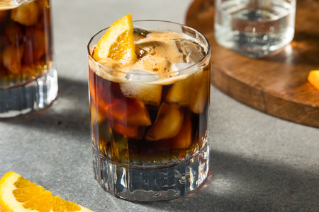 Refreshing Boozy Espresso Tonic Drink with an Orange Garnish