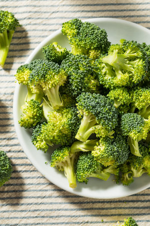 Raw Organic Green Broccoli in a Bowlの写真素材