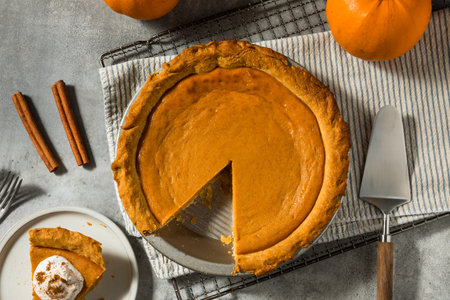 Homemade Orange Thanksgiving Pumpkin Pie Ready to Eatの写真素材