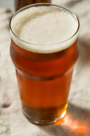Boozy Cold Dark Brown Craft Beer in a Pint Glassの写真素材