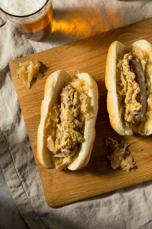 Homemade German Bratwurst Sandwich with Sauerkraut and Mustardの写真素材