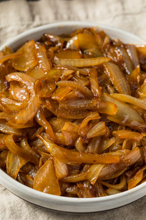 Brown Organic Caramelized Onions in a Bowl to Cook Withの写真素材
