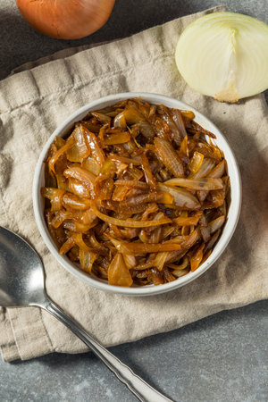 Brown Organic Caramelized Onions in a Bowl to Cook Withの写真素材