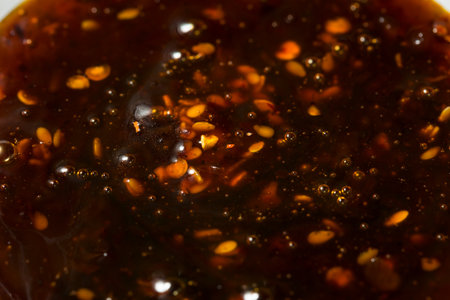 Organic Spicy Hot Honey Chili Crunch in a Bowlの写真素材