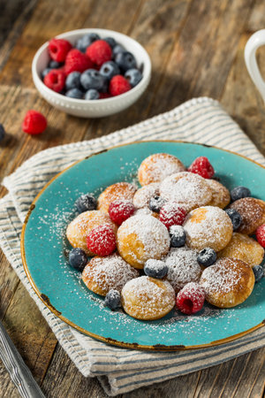 Homemade Dutch Poffertjes Mini Pancakes with Powdered Sugarの写真素材