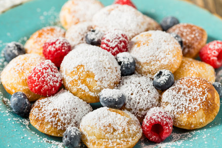 Homemade Dutch Poffertjes Mini Pancakes with Powdered Sugarの写真素材
