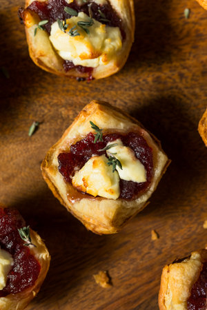 Cranberry Goat Cheese Puff Pastry Appetizer Bites with Thymeの写真素材