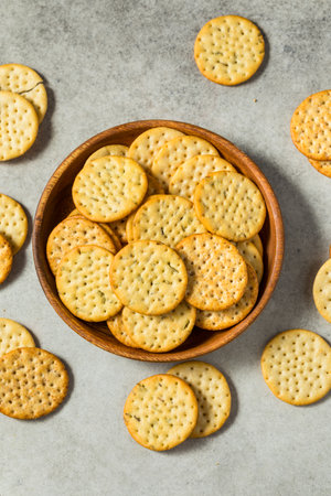 Assorted Round Whole Wheat Crackers in a Bowlの写真素材