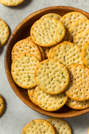 Assorted Round Whole Wheat Crackers in a Bowlの写真素材