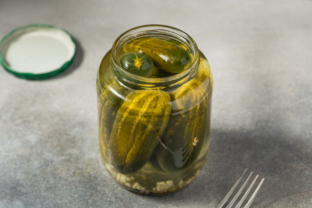 Sour Whole Dill Pickles in a Glass Jarの写真素材