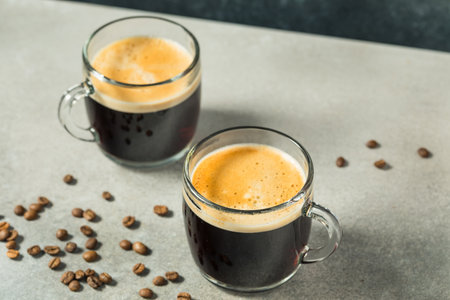 Warm Hot Americano Coffee in a Mug with Waterの写真素材