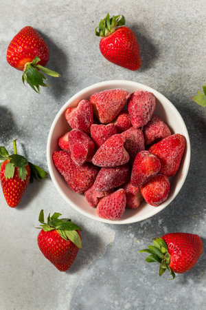 Cold Frozen Organic Strawberries in a Bowlの写真素材