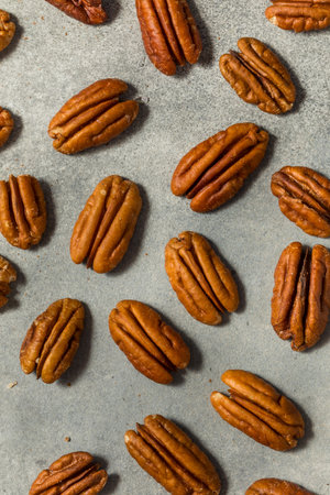 Organic Raw Whole Pecan Nuts in a Bowlの写真素材