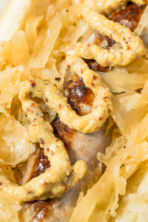 German Homemade Bratwurst Sandwiches with Sauerkraut and Beer for Oktoberfestの写真素材