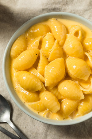 Warm Homemade Macaroni and Cheese Pasta Shells in a Bowl