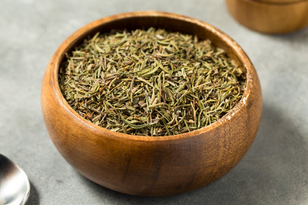 Organic Raw Dry Savory Herbs in a Bowl for Cooking
