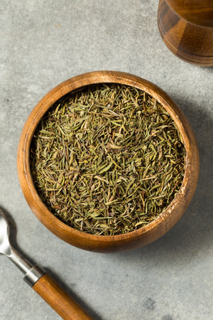Organic Raw Dry Savory Herbs in a Bowl for Cooking