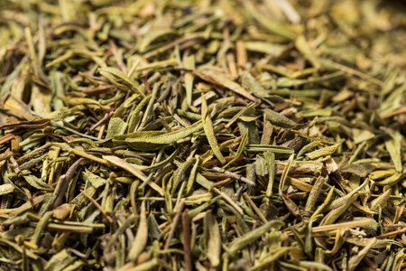 Organic Raw Dry Savory Herbs in a Bowl for Cooking