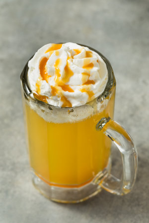 Sweet Butterscotch Butter Beer Cocktail with Whipped Cream and Syrupの写真素材