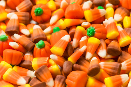 Sweet Autumn Candy Corn Mixture with Pumpkins in a Bowl