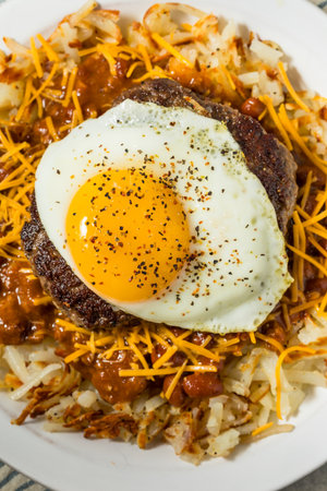 Fatty Slinger Hamburger Plate with Hash Browns Chili and Eggsの写真素材