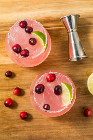 Boozy Refreshing Pink Cranberry Margarita Cocktail with a Salt Rimの写真素材
